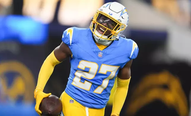 Los Angeles Chargers safety RJ Mickens (27) celebrates his interception during the first half of an NFL football game against the Pittsburgh Steelers Sunday, Nov. 9, 2025, in Inglewood, Calif. (AP Photo/Marcio Jose Sanchez)