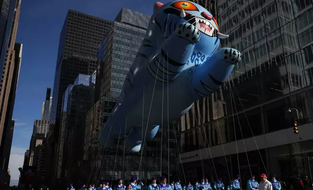 The KPop Demon Hunters balloon makes its way down Sixth Avenue during the Macy's Thanksgiving Day Parade, Thursday, Nov. 27, 2025, in New York. (AP Photo/Heather Khalifa)