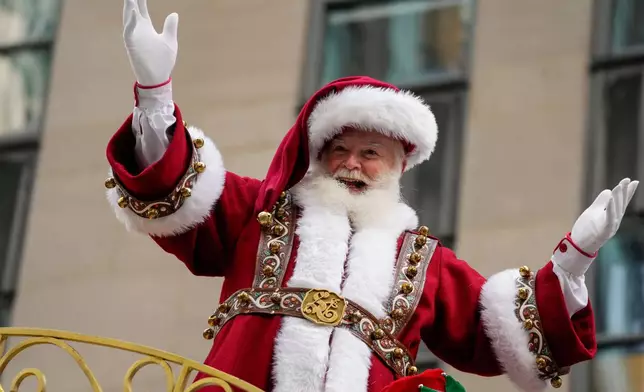 Macy's Santa Claus reacts as he rides on Santa's Sleigh during the Macy's Thanksgiving Day Parade, Thursday, Nov. 27, 2025, in New York. (AP Photo/Eduardo Munoz Alvarez)