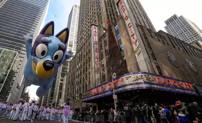 The Bluey balloon floats down Sixth Avenue during the Macy's Thanksgiving Day Parade, Thursday, Nov. 27, 2025, in New York. (AP Photo/Eduardo Munoz Alvarez)