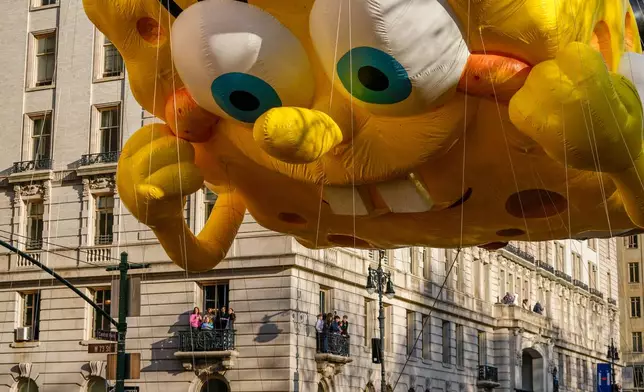 The Sponge Bob balloon floats down Central Park Avenue at 73rd Street during the Macy's Thanksgiving Day Parade, Thursday, Nov. 27, 2025, in New York. (AP Photo/Frank Franklin)