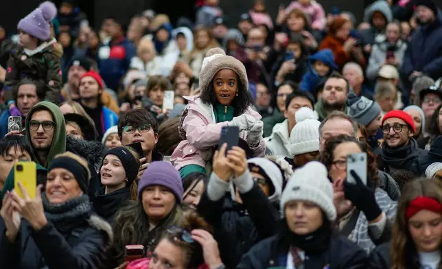Spectators line Sixth Avenue during the Macy's Thanksgiving Day Parade, Thursday, Nov. 27, 2025, in New York. (AP Photo/Eduardo Munoz Alvarez)