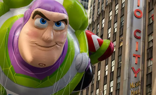 The Buzz Lightyear balloon floats down Sixth Avenue during the Macy's Thanksgiving Day Parade, Thursday, Nov. 27, 2025, in New York. (AP Photo/Eduardo Munoz Alvarez)