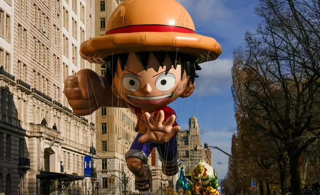 The Monkey D. Luffy balloon floats down Central Park West during the Macy's Thanksgiving Day Parade, Thursday, Nov. 27, 2025, in New York. (AP Photo/Frank Franklin)