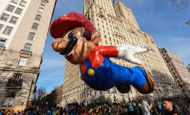 The Mario balloon floats down Central Park West during the Macy's Thanksgiving Day Parade, Thursday, Nov. 27, 2025, in New York. (AP Photo/Frank Franklin II)