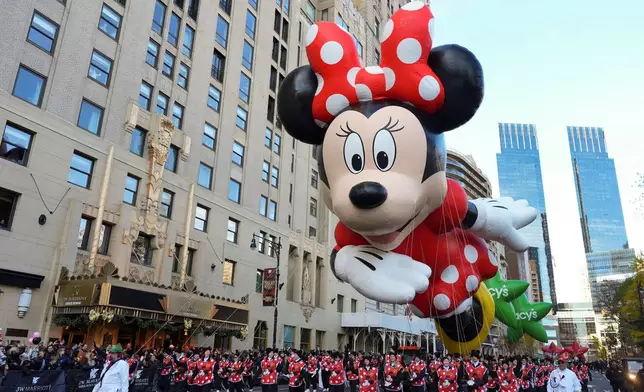 Disney's Minnie Mouse balloon floats down Central Park South during the Macy's Thanksgiving Day Parade, Thursday, Nov. 27, 2025, in New York. (AP Photo/Frank Franklin II)