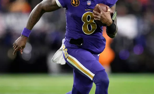 Baltimore Ravens quarterback Lamar Jackson runs with the ball during the second half of an NFL football game against the Cincinnati Bengals, Thursday, Nov. 27, 2025, in Baltimore. (AP Photo/Nick Wass)