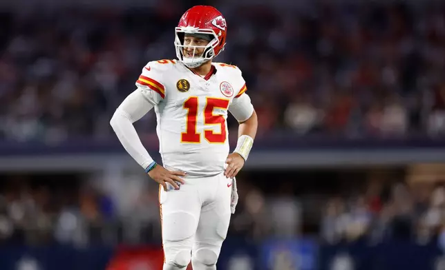 Kansas City Chiefs quarterback Patrick Mahomes (15) pauses during the second half of an NFL football game against the Dallas Cowboys Thursday, Nov. 27, 2025, in Arlington, Texas. (AP Photo/Gareth Patterson)