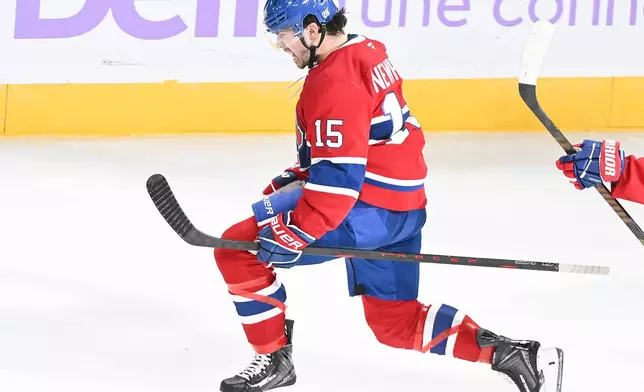 Montreal Canadiens' Alex Newhook (15) celebrates after scoring against the Utah Mammoth during second period NHL hockey action in Montreal, Saturday, Nov. 8, 2025. (Graham Hughes/The Canadian Press via AP)