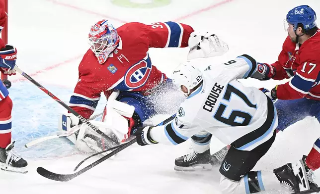 Utah Mammoth's Lawson Crouse (67) scores against Montreal Canadiens goaltender Sam Montembeault during second period NHL hockey action in Montreal, Saturday, Nov. 8, 2025. (Graham Hughes/The Canadian Press via AP)