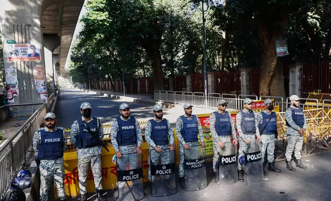 Policemen stand guard outside International Crimes Tribunal after security has been beefed up across the country ahead of an expected verdict against ousted Prime Minister Sheikh Hasina, in Dhaka, Bangladesh, Monday, Nov. 17, 2025. (AP Photo/Rajib Dhar)