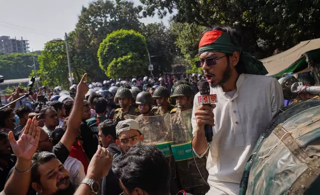 Protesters shout slogans outside the demolished residence of Sheikh Mujibur Rahman, Bangladesh's former leader and the father of the country's ousted Prime Minister Sheikh Hasina ahead of an expected verdict against Hasina, in Dhaka, Bangladesh, Monday, Nov. 17, 2025. (AP Photo/Ahadul Karim Khan)