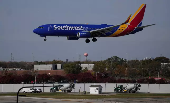 A Southwest Airlines airplane lands at Midway International Airport, Thursday, Nov. 6, 2025, in Chicago. (AP Photo/Erin Hooley)