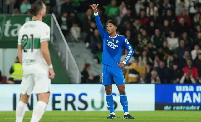 Real Madrid's Jude Bellingham celebrates after scoring his side's second goal during the Spanish La Liga soccer match between Elche and Real Madrid in Elche, Spain, Sunday, Nov. 23, 2025. (AP Photo/Alberto Saiz)