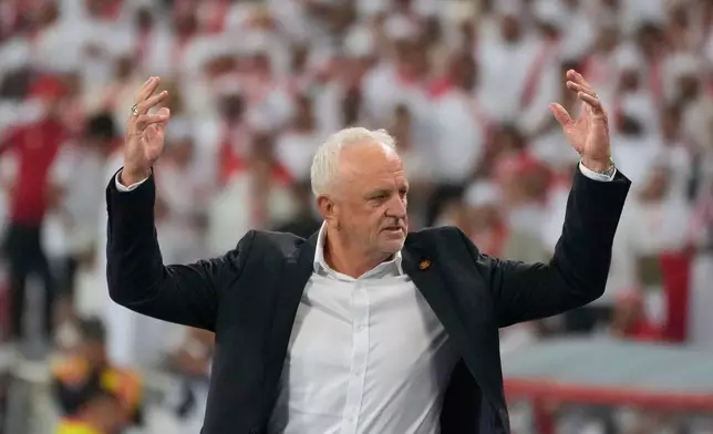 Iraqi's head coach Graham Arnold celebrates his team's win during the 2026 World Cup play off second leg soccer match between UAE and Iraq, in Basra, Iraq, Nov. 18, 2025. (AP Photo/Hadi Mizban)