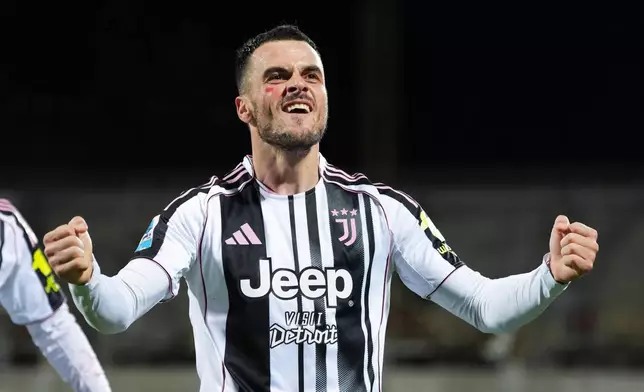 Juventus' Filip Kostic celebrates scoring during the Serie A soccer match between Fiorentina and Juventus in Florence, Italy, Saturday Nov. 22, 2025. (Massimo Paolone/LaPresse via AP)
