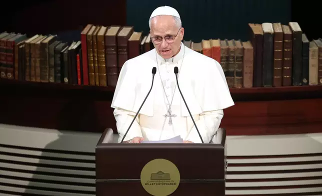 Pope Leo XIV delivers his speech as he meets with authorities, members of the civil society and diplomats in the Presidential Palace's national library, in Ankara, Turkey, Thursday, Nov. 27, 2025. (Yavuz Ozden/Dia Photo via AP)