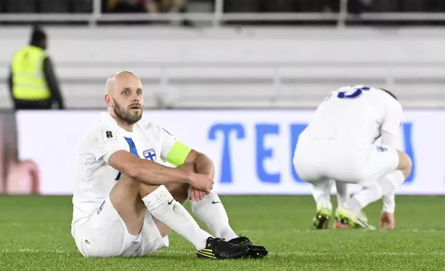 Finland's Teemu Pukki, left, and Oiva Jukkola react the FIFA World Cup 2026 Group G qualifying soccer match between Finland and Malta in Helsinki, Finland, Friday, Nov. 14, 2025. (Heikki Saukkomaa/Lehtikuva via AP)