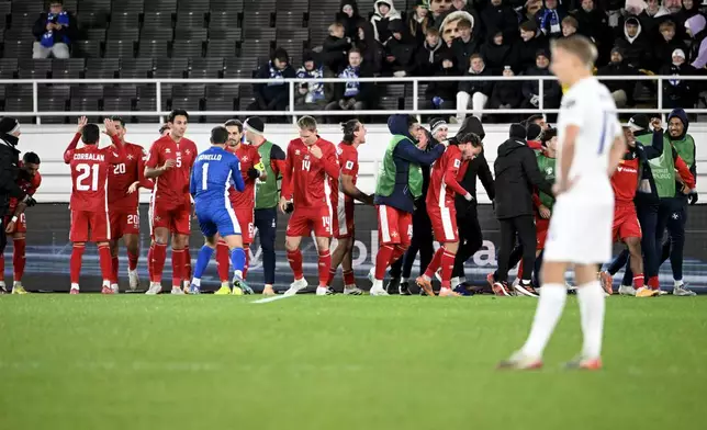 Players of Malta celebrate a goal by Jake Grech during the FIFA World Cup 2026 Group G qualifying soccer match between Finland and Malta in Helsinki, Finland, Friday, Nov. 14, 2025. (Heikki Saukkomaa/Lehtikuva via AP)