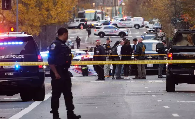 Streets are blocked after reports that two National Guard soldiers were shot near the White House in Washington, Wednesday, Nov. 26, 2025. (AP Photo/Anthony Peltier)
