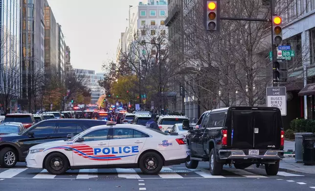 Streets are blocked after reports of two National Guard soldiers were shot near the White House in Washington, Wednesday, Nov. 26, 2025. (AP Photo/Evan Vucci)