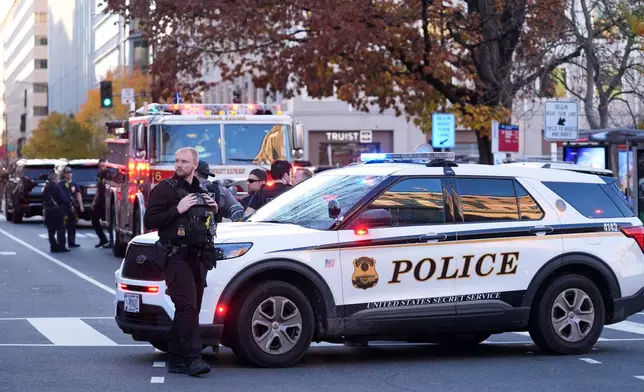 Streets are blocked after reports of two National Guard soldiers were shot near the White House in Washington, Wednesday, Nov. 26, 2025. (AP Photo/Evan Vucci)