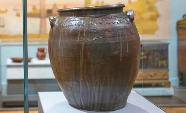 A stoneware vessel created by enslaved potter David Drake is seen at the Museum of Fine Arts, Monday, Nov. 10, 2025, in Boston. (AP Photo/Robert F. Bukaty)