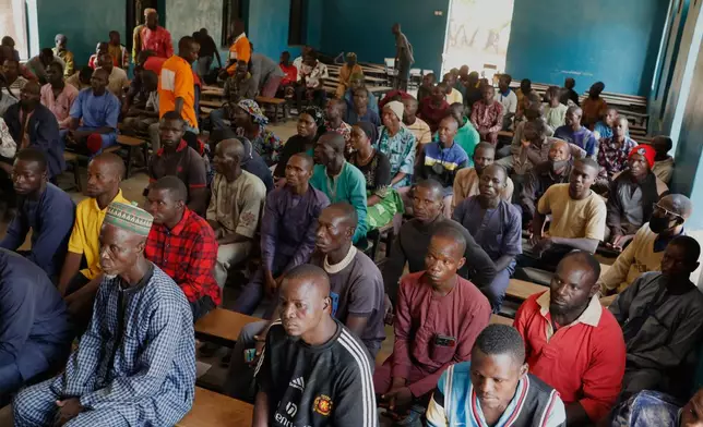 Parents of abducted school children gather at the St. Mary's Catholic Primary and Secondary School in Papiri community, Nigeria, Friday, Nov. 28, 2025. (AP Photo )
