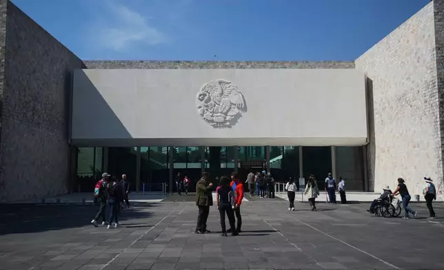 The entrance of Mexico City's National Museum of Anthropology features Mexico's national emblem on its façade, Friday, Nov. 14, 2025. (AP Photo/Claudia Rosel)
