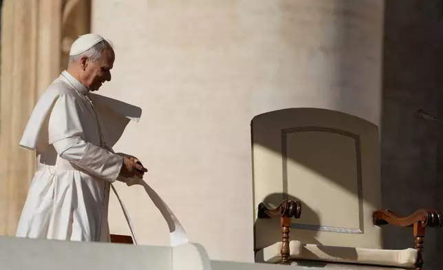 Pope Leo XIV arrives in St. Peter's Square on the occasion of the weekly general audience at the Vatican, Wednesday, Nov. 19, 2025. (AP Photo/Gregorio Borgia)