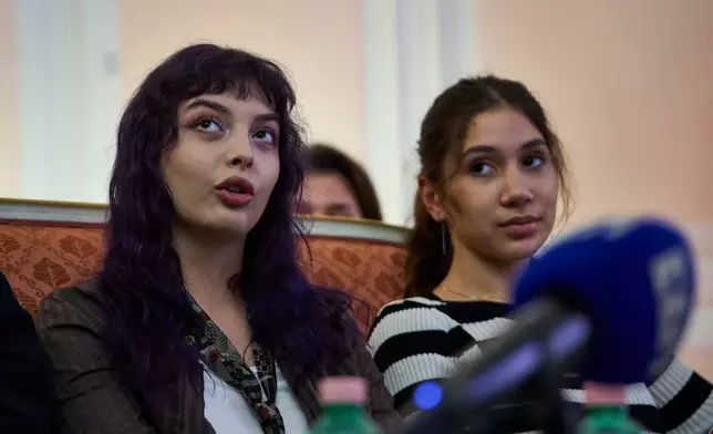Marta Hlazkova, left, and Veronika Vlasova attend a press conference on the return of Ukrainian children and civilians taken by Russia during the three-and-a-half-year war, at the Embassy of Ukraine in Italy, in Rome, Wednesday, Nov. 19, 2025. (AP Photo/Domenico Stinellis)