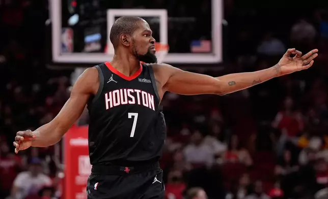 Houston Rockets forward Kevin Durant celebrates after a 3-pointer during the second half of an NBA Cup basketball game against the Portland Trail Blazers in Houston, Friday, Nov. 14, 2025. (AP Photo/Ashley Landis)