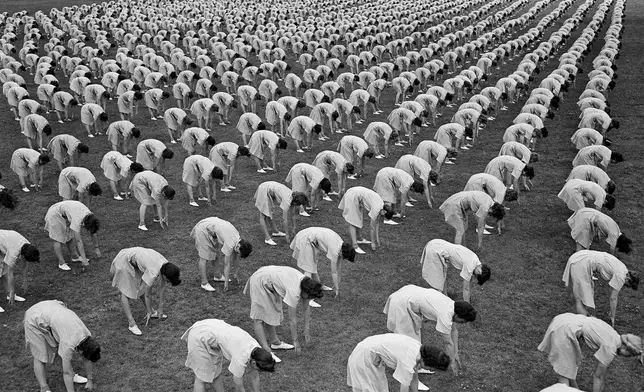 FILE - Over 2,000 members of the Women's Army Auxiliary Corps (WAAC) take part in a mass calisthenics exercise in Fort Oglethorpe, Ga., on May 15, 1943. (AP Photo/B.I. Sanders, File)