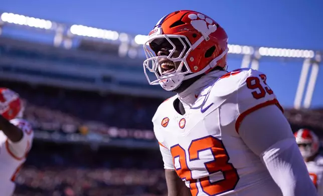 Clemson defensive lineman Caden Story (93) celebrates after an interception against the South Carolina in the first half of an NCAA college football game, Saturday, Nov. 29, 2025, in Columbia, S.C. (AP Photo/Scott Kinser)