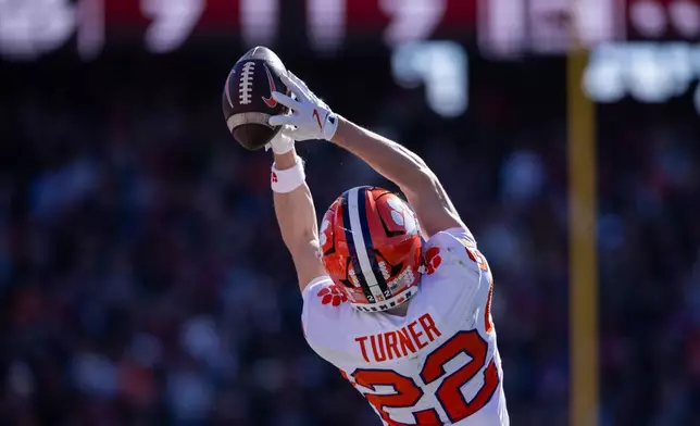 Clemson wide receiver Cole Turner (22) makes a catch against the South Carolina during the first half of an NCAA college football game, Saturday, Nov. 29, 2025, in Columbia, S.C. (AP Photo/Scott Kinser)