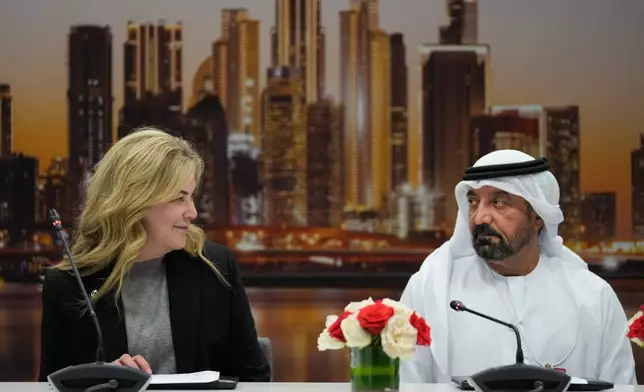Stephanie Pope, President and CEO of Boeing Commercial Airplanes, left, Sheikh Ahmed bin Saeed Al Maktoum, President, Dubai Civil Aviation Authority and Chairman of Emirates airlines, speak during a press conference on the opening day of the Dubai Air Show, United Arab Emirates, Monday, Nov. 17, 2025. (AP Photo/Altaf Qadri)