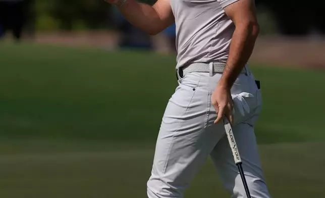 Rory McIlroy of Northern Ireland reacts after a birdie on the 1st hole during the third round of World Tour Golf Championship at Jumeirah Golf Estates, in Dubai, United Arab Emirates, Saturday, Nov. 15, 2025. (AP Photo/Altaf Qadri)