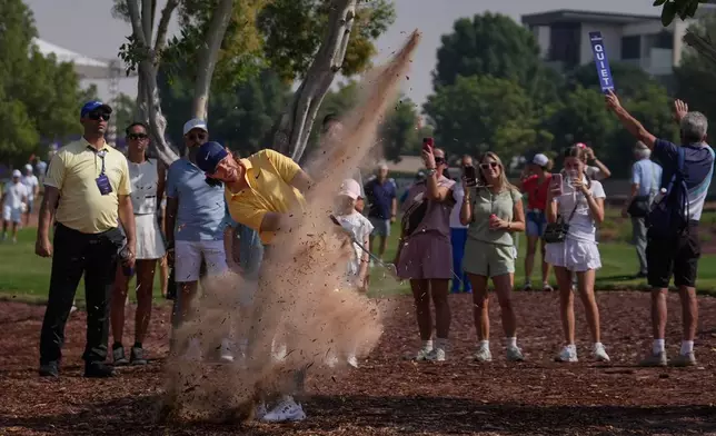 Tommy Fleetwood of England hits from the rough outside the 1st fairway during the third round of World Tour Golf Championship at Jumeirah Golf Estates, in Dubai, United Arab Emirates, Saturday, Nov. 15, 2025. (AP Photo/Altaf Qadri)