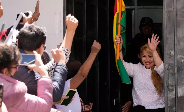 Former Bolivian President Jeanine Anez walks free from the Miraflores jail after the Supreme Court annulled her 10-year prison sentence in La Paz, Bolivia, Thursday, Nov. 6, 2025. (AP Photo/Juan Karita)