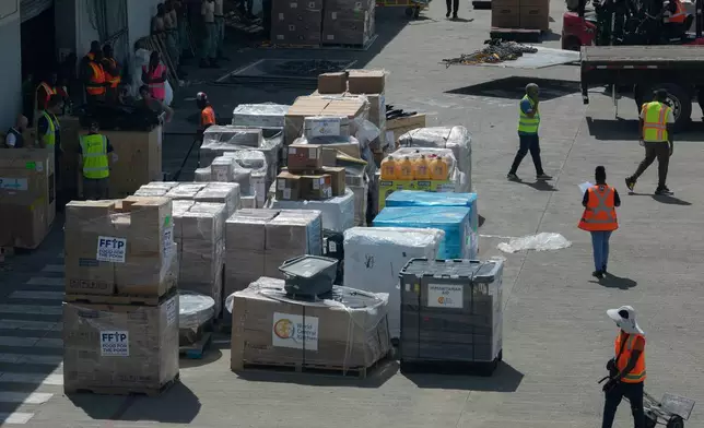 Humanitarian aid sits on the tarmac at the Norman Manley International Airport in Kingston, Jamaica, Saturday, Nov. 1, 2025, in the aftermath of Hurricane Melissa. (AP Photo/Matias Delacroix)