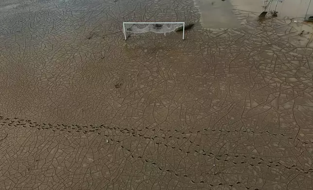 Mud covers a soccer goal in Montego Bay, Jamaica, Friday, Oct. 31, 2025, in the aftermath of Hurricane Melissa. (AP Photo/Matias Delacroix)