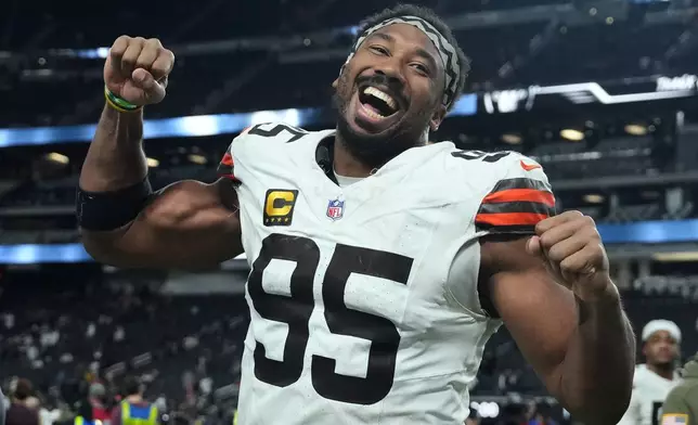 Cleveland Browns defensive end Myles Garrett (95) celebrates after the Cleveland Browns defeated the Las Vegas Raiders in an NFL football game Sunday, Nov. 23, 2025, in Las Vegas. (AP Photo/Candice Ward)