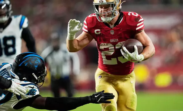 San Francisco 49ers running back Christian McCaffrey runs for a touchdown against the Carolina Panthers during the second half an NFL football game, Monday, Nov. 24, 2025, in Santa Clara, Calif. (AP Photo/Godofredo A. Vásquez)