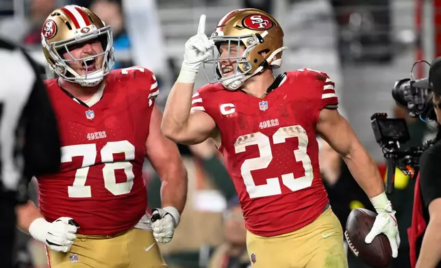 San Francisco 49ers running back Christian McCaffrey celebrates after scoring against the Carolina Panthers during the second half an NFL football game, Monday, Nov. 24, 2025, in Santa Clara, Calif. (AP Photo/Eakin Howard)