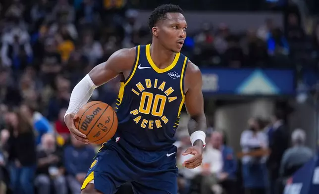 Indiana Pacers forward Bennedict Mathurin (00) plays against the Charlotte Hornets during the second half of an NBA basketball game in Indianapolis, Wednesday, Nov. 19, 2025. (AP Photo/Michael Conroy)