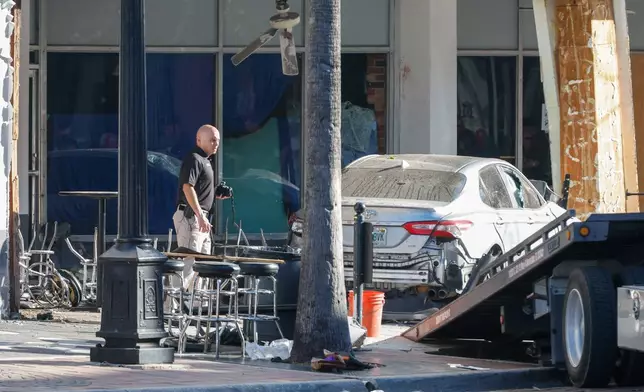 Law enforcement investigates a car crash scene on Saturday, Nov. 8, 2025, in Tampa, Fla. (Jefferee Woo/Tampa Bay Times via AP)
