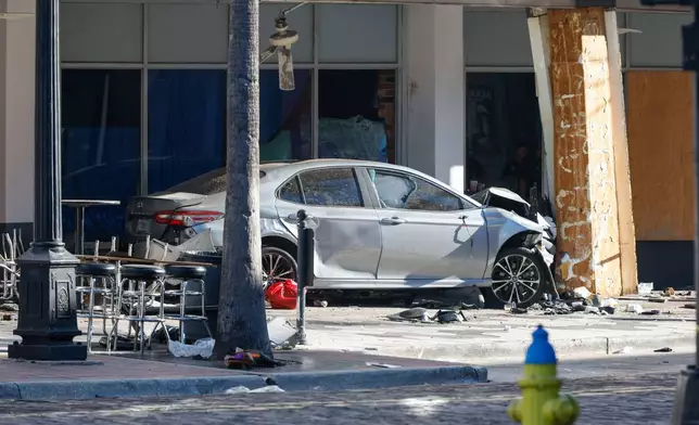 A car that crashed into a local business is shown on Saturday, Nov. 8, 2025, in Tampa, Fla. (Jefferee Woo/Tampa Bay Times via AP)