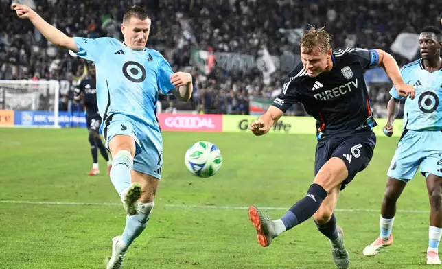 San Diego FC defender Jeppe Tverskov (6) shoots past Minnesota United midfielder Robin Lod (17) during the first half of MLS soccer's Western Conference semifinal Monday, Nov. 24, 2025, in San Diego. (AP Photo/Denis Poroy)