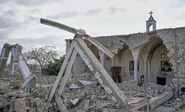 Icons hang on the remaining walls of St. George Melkite Catholic Church, which was destroyed in an Israeli airstrike, in the town of Dardghaya, southern Lebanon, Sunday, Nov. 16, 2025. (AP Photo/Hassan Ammar)