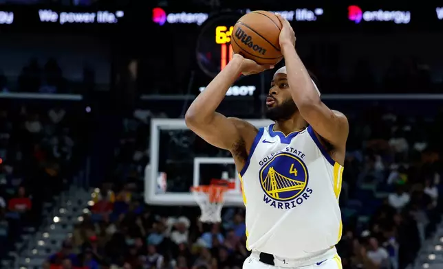 Golden State Warriors guard Moses Moody shoots a three-pointer against the New Orleans Pelicans during the first quarter of an NBA basketball game, Sunday, Nov. 16, 2025, in New Orleans. (AP Photo/Butch Dill)